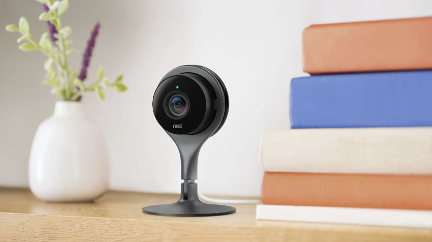 Lifestyle image of a Google Nest Camera on a desk.