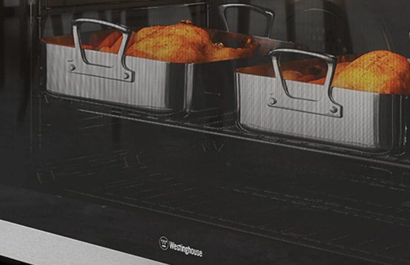 Close-up image of Westinghouse oven cooking chicken, 