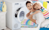 A mum with her son on her back in the laundry room 