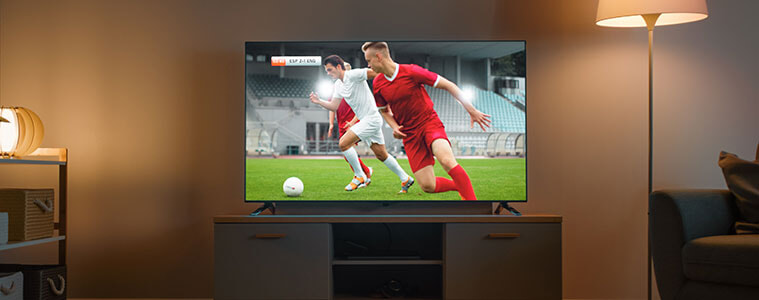 Shot of a living room TV screening a soccer match