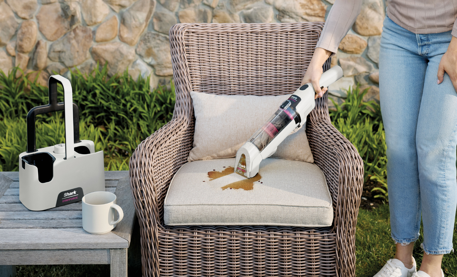 Shark StainForce Portable Spot & Stain Cleaner cleaning up spilt coffee