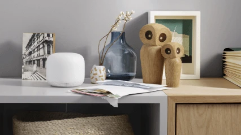 Lifestyle image of a Google Nest Wifi on a study desk