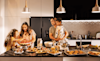Family enjoying a range of foods prepared with the Haier range