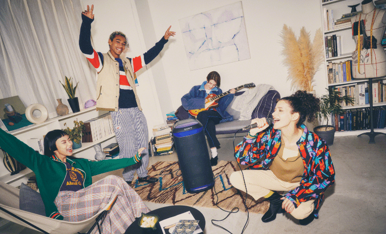 People having a party in the loungeroom with the Sony XV800 XSeries Portable Party Speaker 