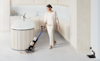 woman cleans floor with Dyson WashG1™ Wet Cleaner