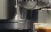 Close up side on shot of stylish Ninja Coffee Machine making espresso.