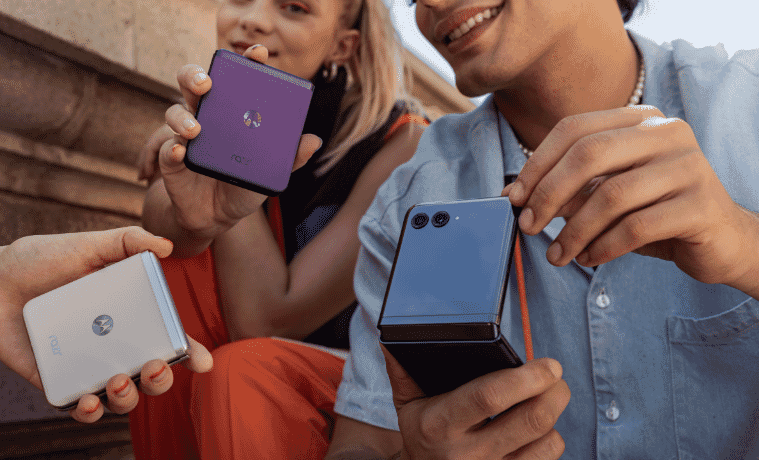 3 people holding their Motorola razr 40 flip phones 