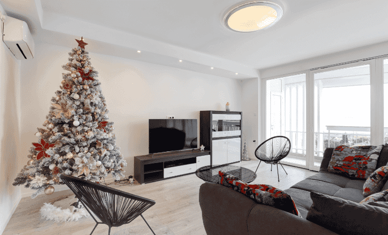 An apartment living room decorated for Christmas