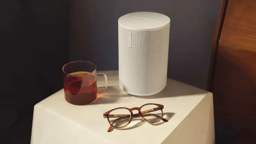Bed side table featuring a cup of tea glasses and the sleek white Sonos Era 100
