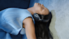 A woman dancing while wearing her Bose Quietcomfort Ultra Headphones