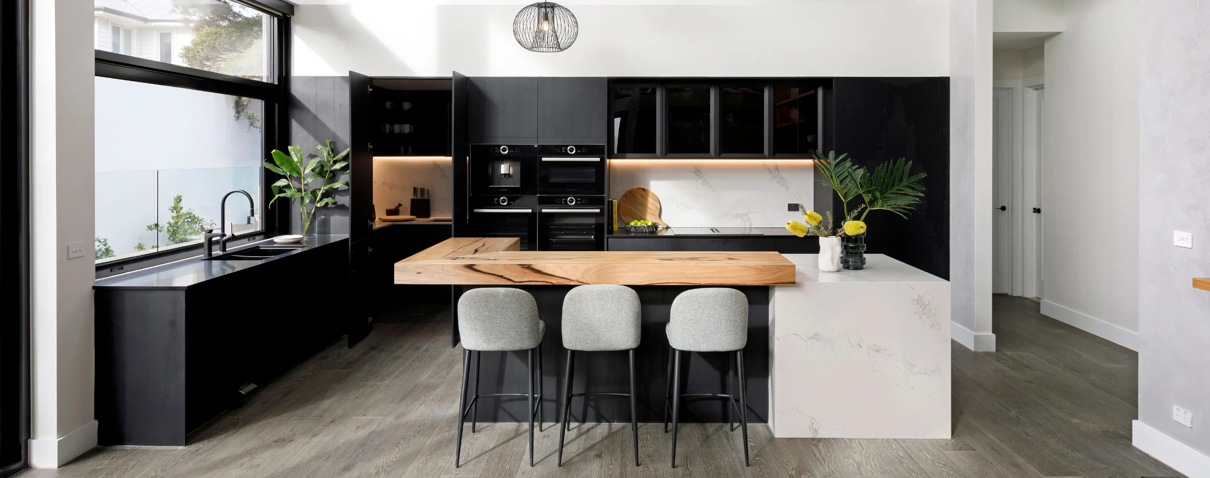 lifestyle image of a kitchen with dark appliances