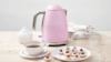 Pink smeg kettle in a modern kitchen