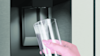 Close-up image of Haier's 600 Series Quad Door Refrigerator Freezer water dispenser.