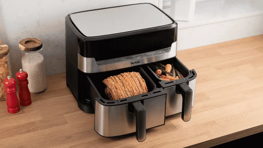 The Tefal Dual Easy Fry cooking a pork roast and vegetables simultaneously