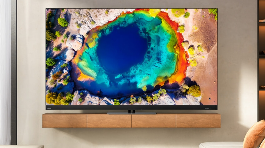 A Toshiba TV sitting on a brown console table in a contemporary living room