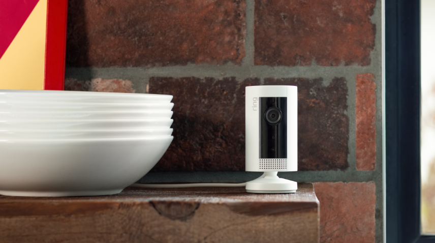 Ring security camera sitting on bench inside home