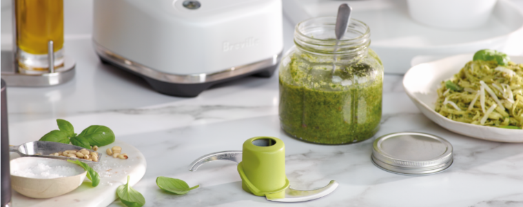 Lifestyle image of breville food processor next to basil pesto