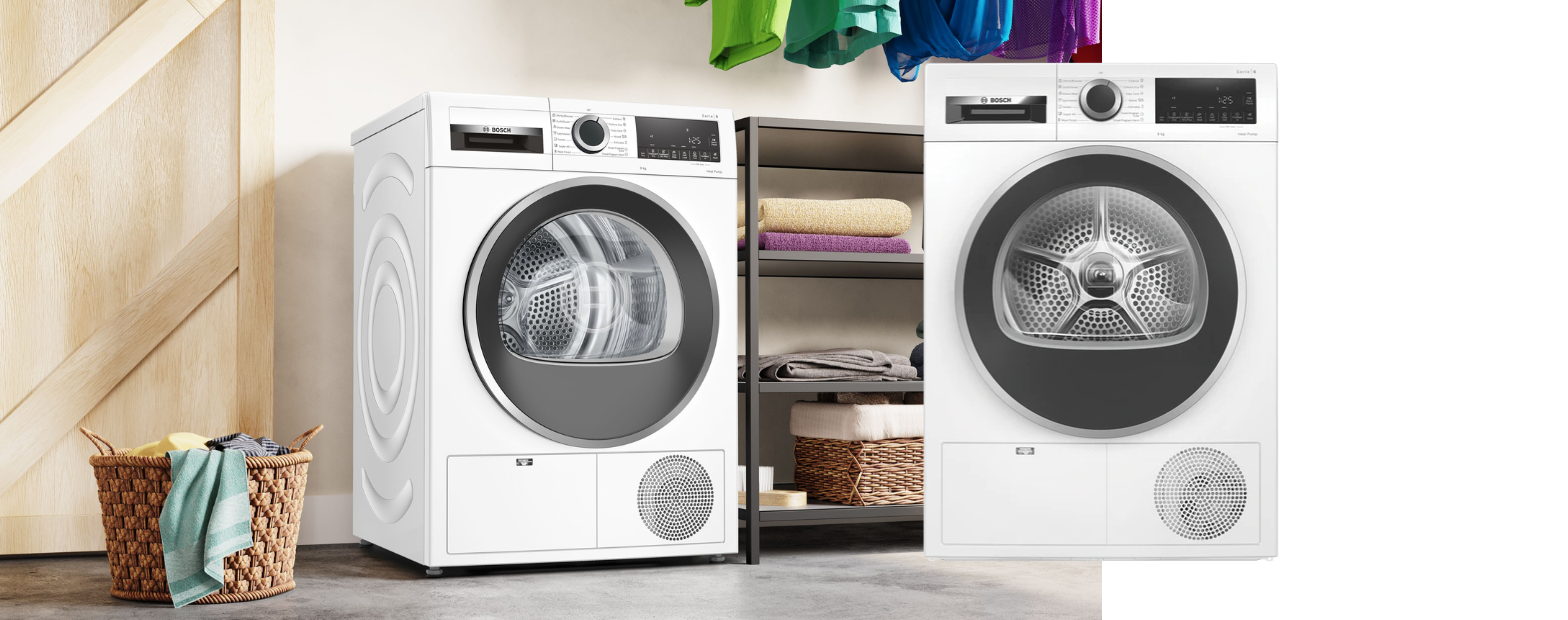 a woman pully out dried clothes from her white Bosch heat pump dryer 