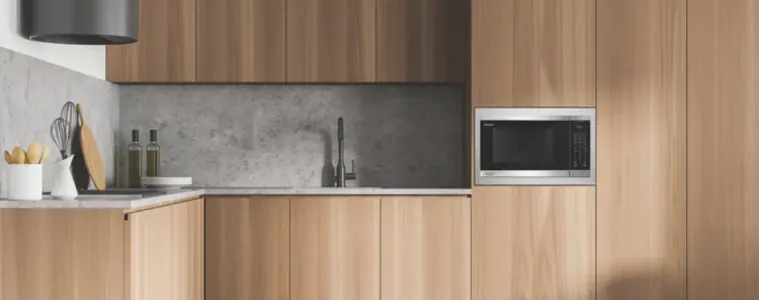 Image of a built-in Sharp 32L 1200W Flatbed Microwave Stainless Steel in a modern kitchen.
