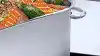 Beko induction cooktop showing how you can combine zones to create a larger one with a large dish situated on the cooktop.