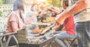 Family enjoying an outdoor barbecue.