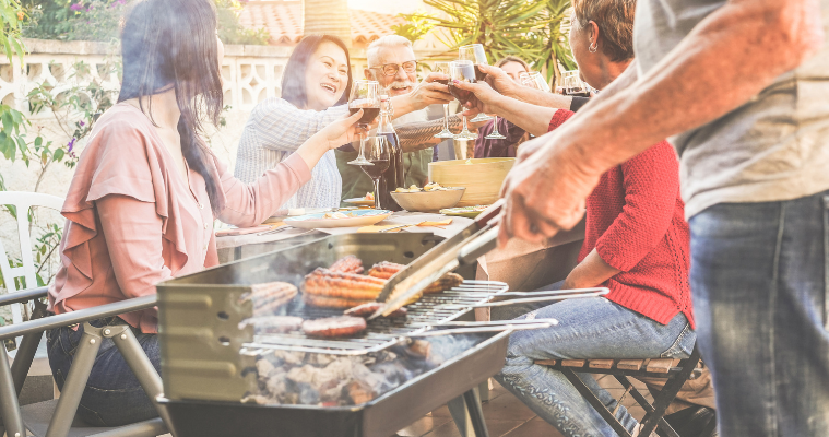 Family enjoying an outdoor barbecue.