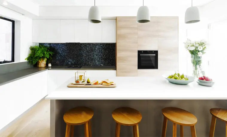 A white modern kitchen with timber accents