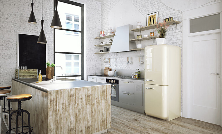 Retro style cream coloured fridge in a modern industrial style kitchen