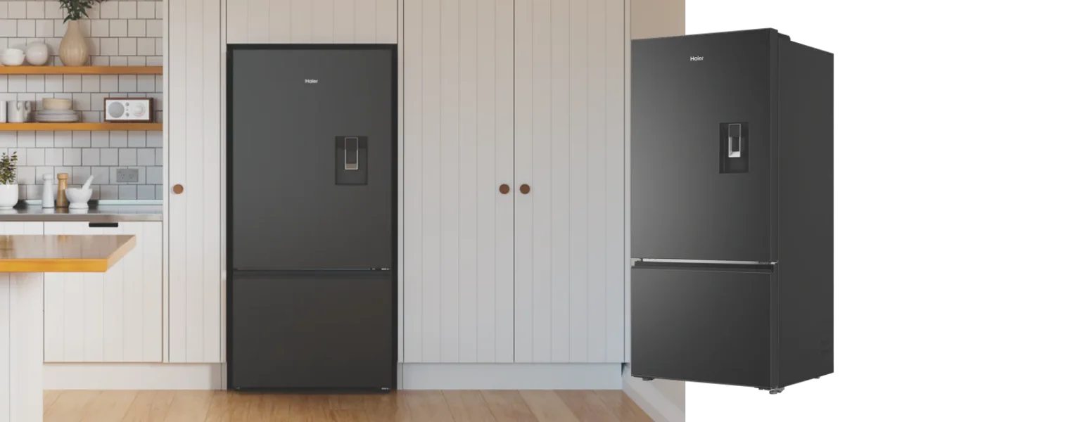 Side and front angle of the Haier 514L Bottom Mount Refrigerator in a kitchen