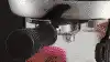 The breville bambino next to a cake and range of coffees