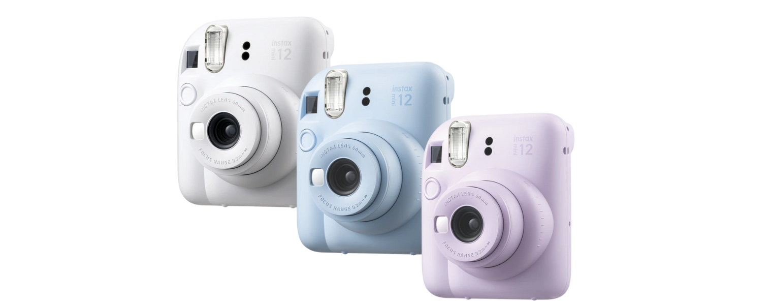 image of white purple and blue instax cameras