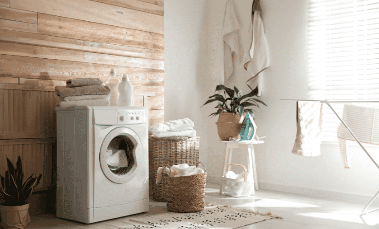 Stylish laundry room interior with modern washing machine