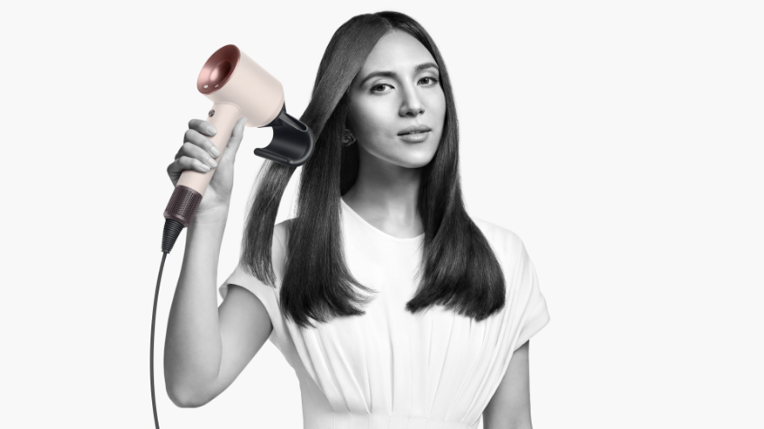 3 women using their Dyson supersonic hair dryers to dry their hair without damage