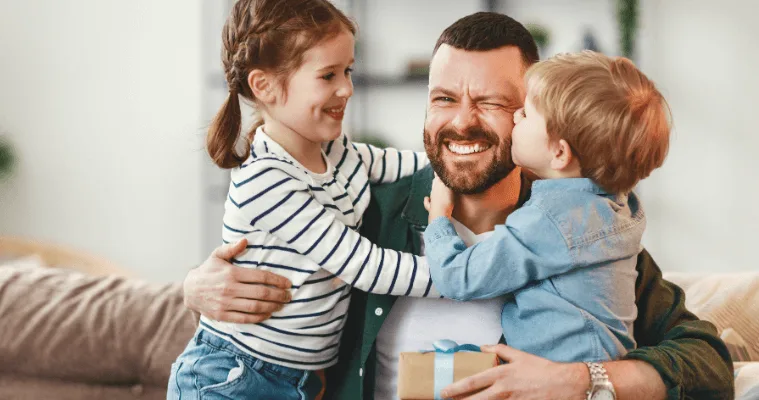 kids giving their Dad a Fathers Day gift