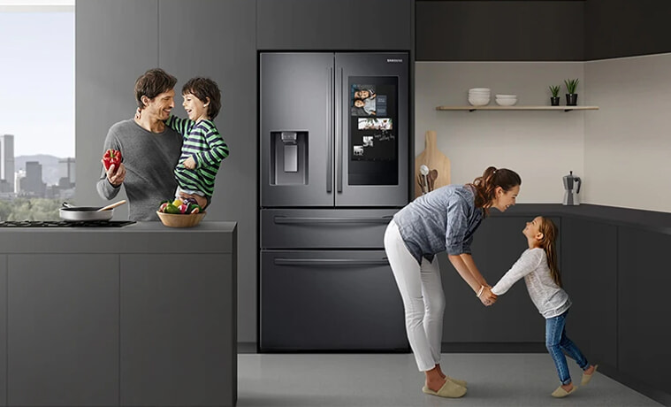 A young family get ready in the morning with help from their smart fridge