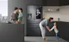 A young family get ready in the morning with help from their smart fridge