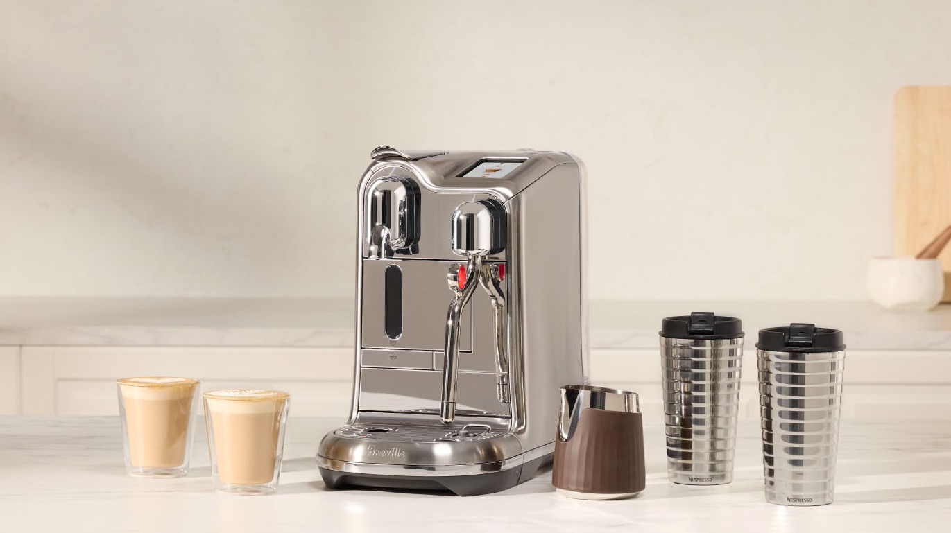 The new Nespresso Creatista coffee machine on a bench making coffee  The Good Guys