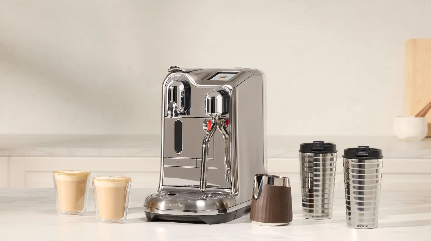 The new Nespresso Creatista coffee machine on a bench making coffee The Good Guys