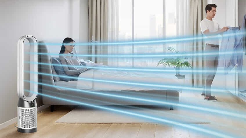 couple relax in bedroom with Dyson fan