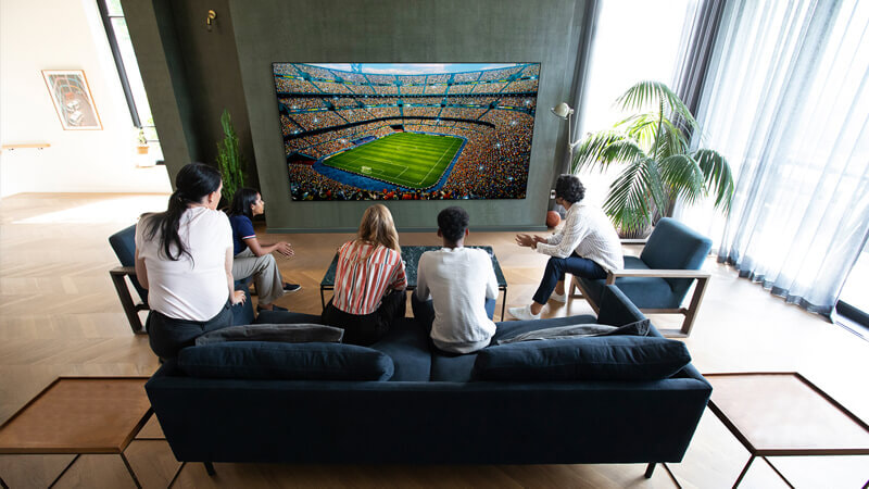 Group of friends watching the game on their amazing new LG OLED TV