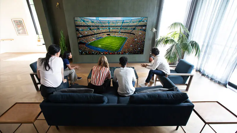 Group of friends watching the game on their amazing new LG OLED TV