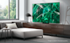 The Samsung 77 S95C 4K OLED Smart TV 2023 mounted on a loungeroom wall 