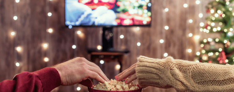 a couple watching a Christmas movie together 