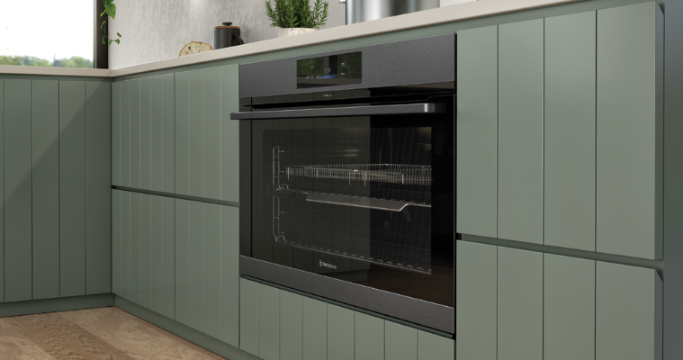 A white and sage green kitchen with Westinghouse kitchen appliances