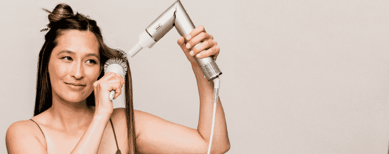 a woman using the Shark Flex Style Air Styling and Drying System Silver