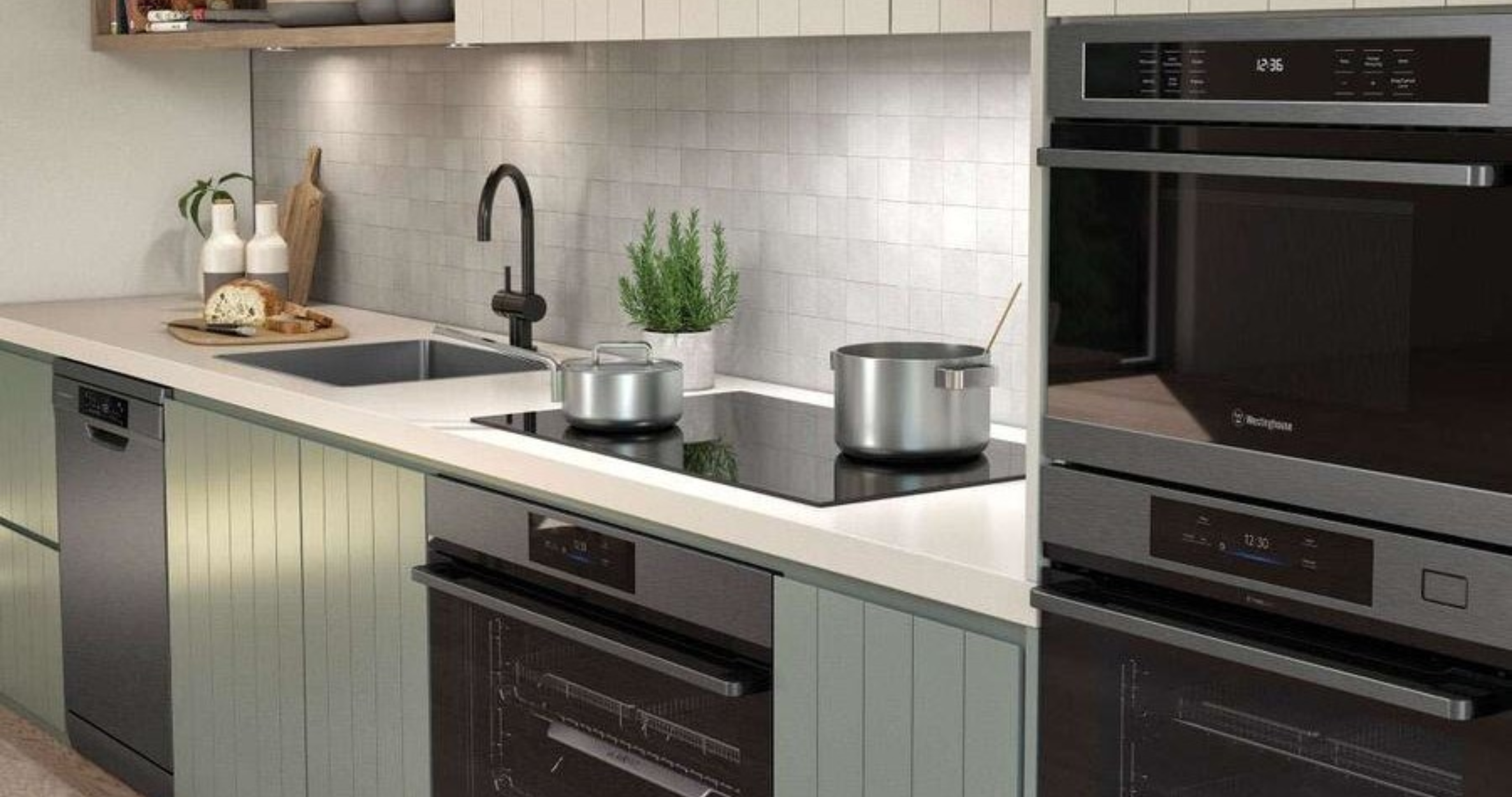 Image of a modern kitchen fitted with Westinghouse double ovens, induction cooktops and dishwasher.
