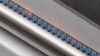 A close up of the burners on a Weber BBQ