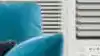 Air conditioning unit on windowsill in living room.