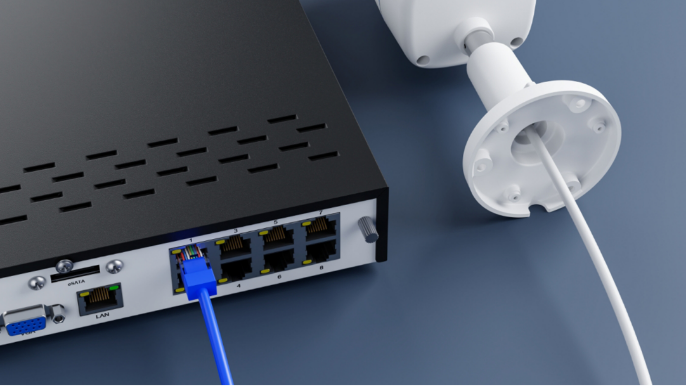 Image of a Reolink security camera plugged into a Network Video Recorder