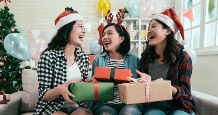 Image of friends exchanging Christmas gifts